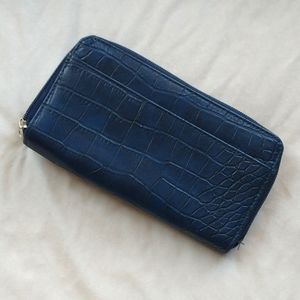 Used navy blue wallet with many card slots and pockets!